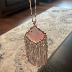 This is a silver adjustable Kendra Scott necklace in silver. Never worn.